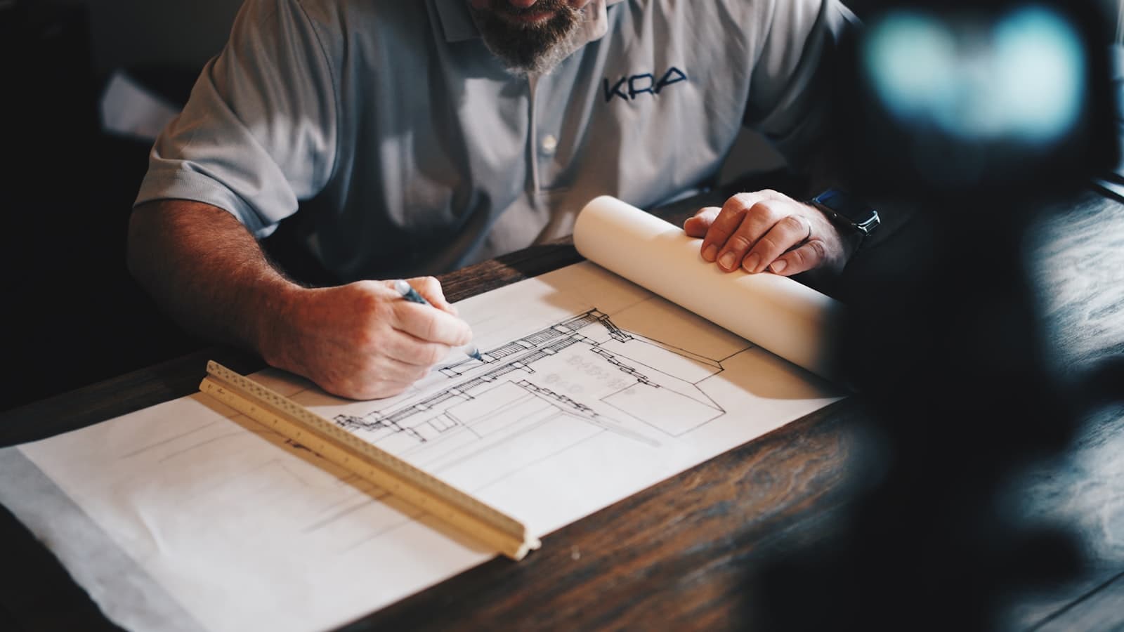Estimator working through a set of construction drawings